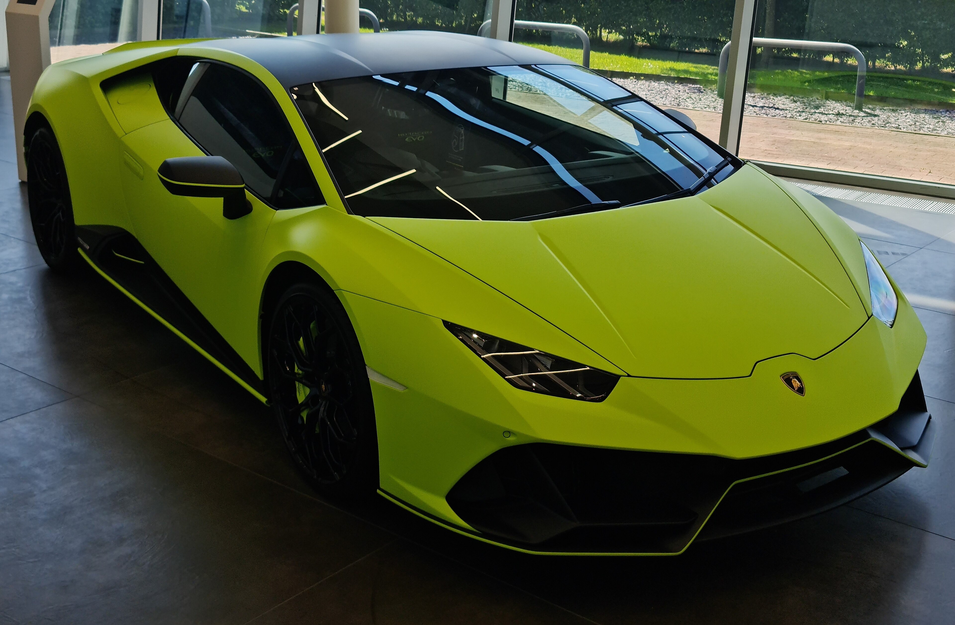Green Lamborghini Huracán EVO in front three-quarter view